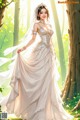 A woman in a wedding dress standing in the woods.